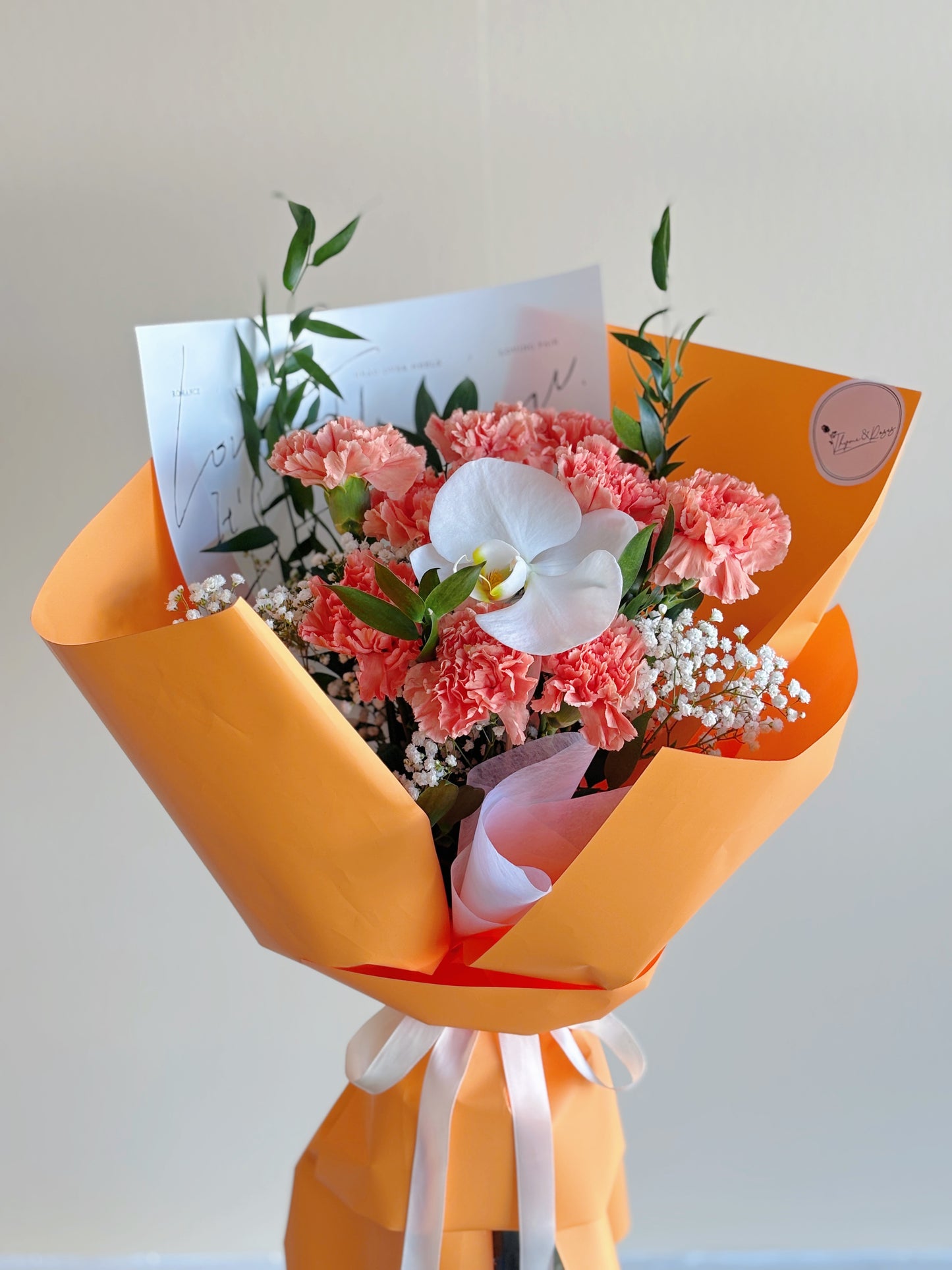 Mother's Day Bouquet - 9 Orange Carnations + Phalaenopsis