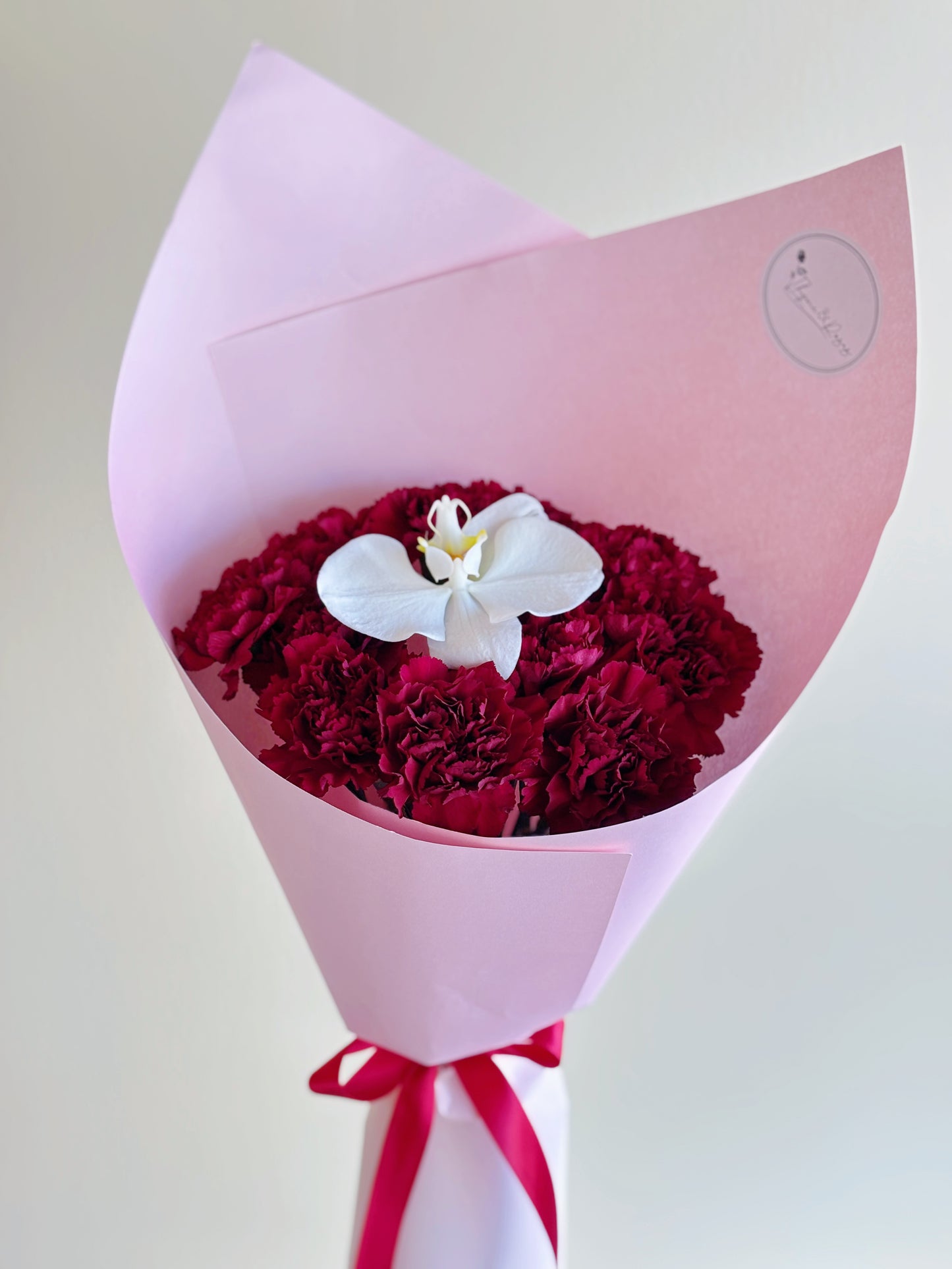 Mother's Day Bouquet - 9 Red Carnations + Orchid