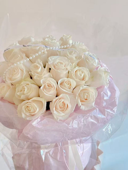 20 white rose bouquet in ballet pink style wrapping