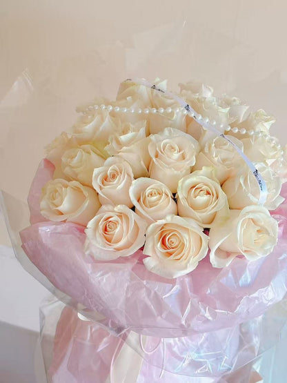 20 white rose bouquet in ballet pink style wrapping