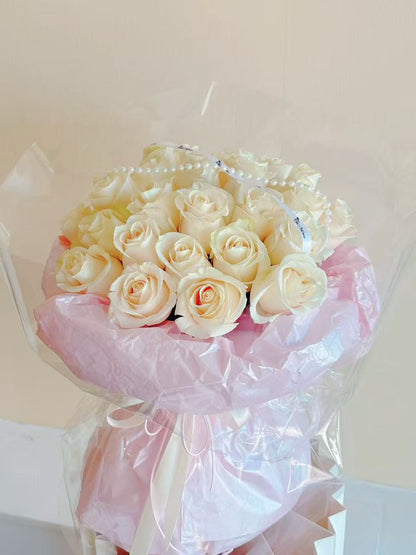 20 white rose bouquet in ballet pink style wrapping
