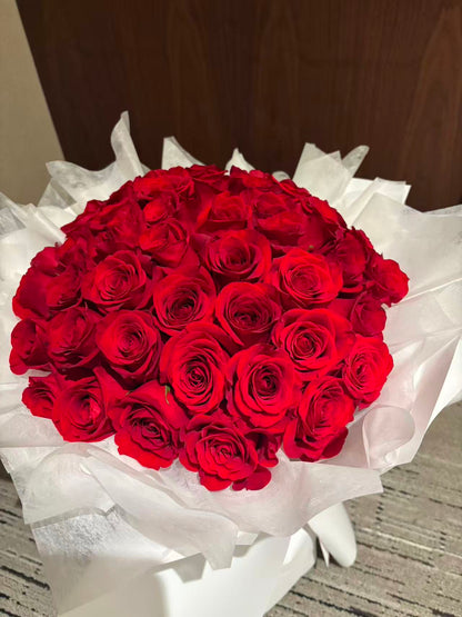 Pure Passion-33 red roses with white wrapping bouquet