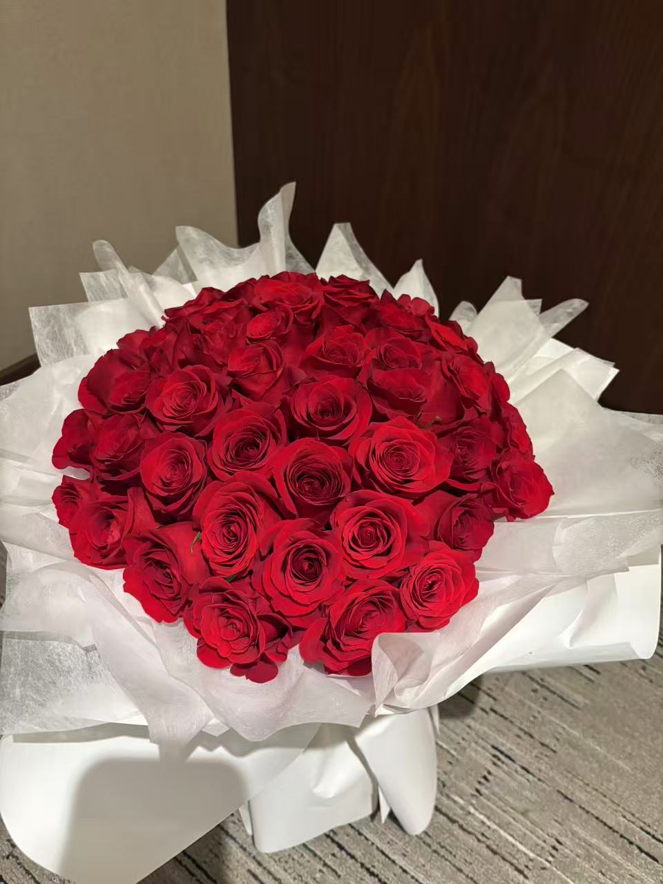 Pure Passion-33 red roses with white wrapping bouquet