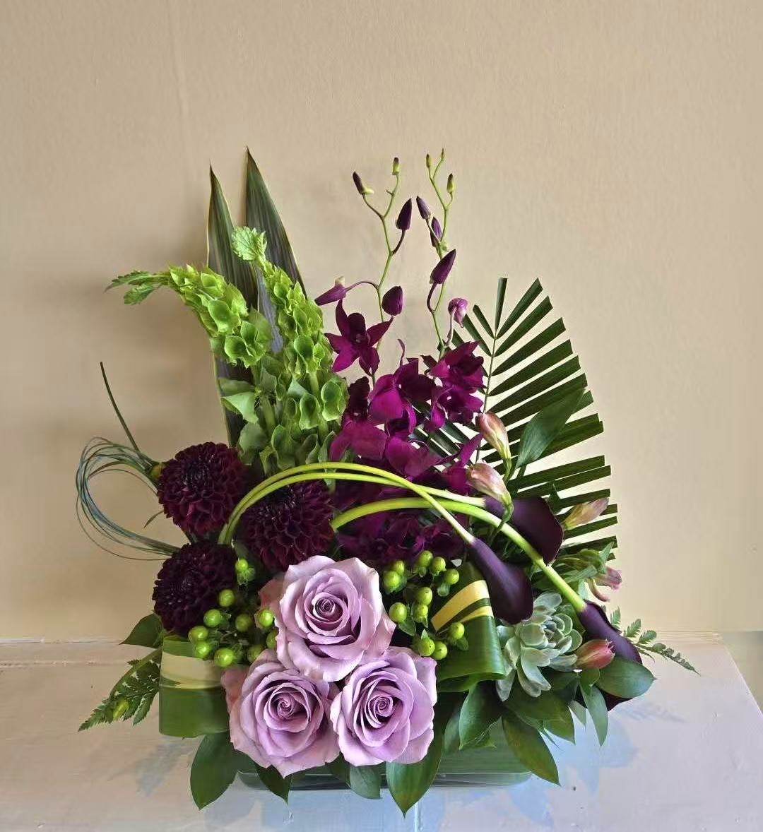 Purple front desk floral arrangement